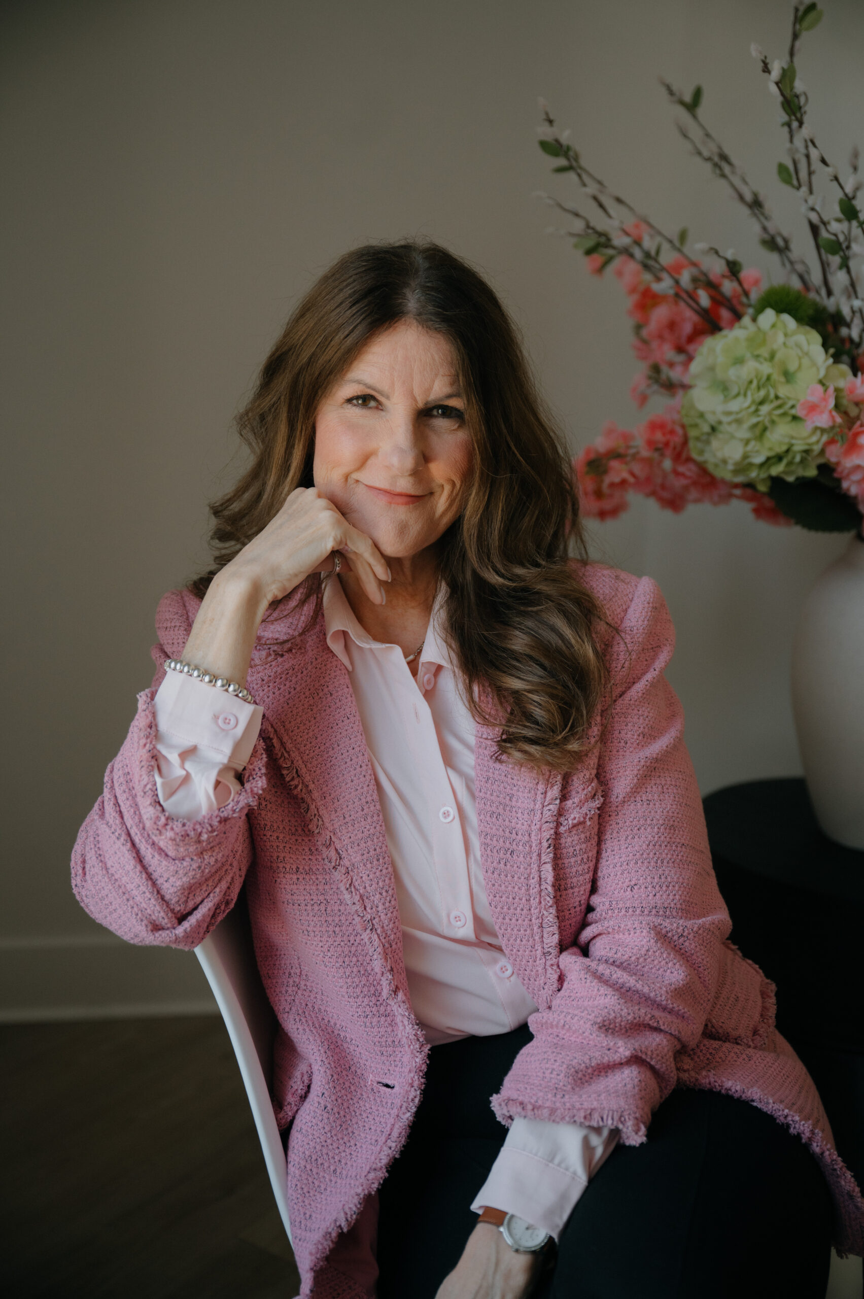 Erin Kennedy executive resume writer pink blazer portrait